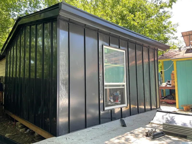 Black standing seam metal wall panels for Roof Inspection in Solon